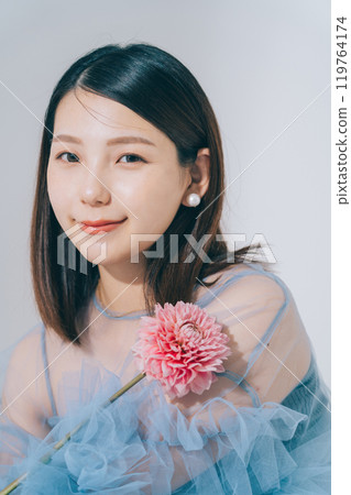 Beauty image of young woman and flowers 119764174
