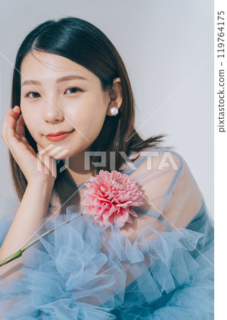 Beauty image of young woman and flowers 119764175