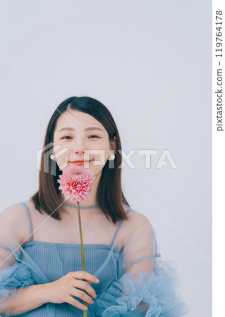 Beauty image of young woman and flowers 119764178