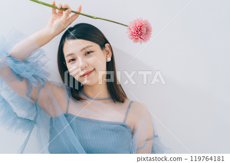 Beauty image of young woman and flowers 119764181