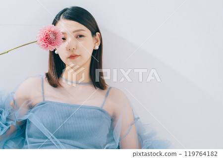 Beauty image of young woman and flowers 119764182