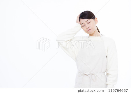 A woman suffering from a headache 119764667
