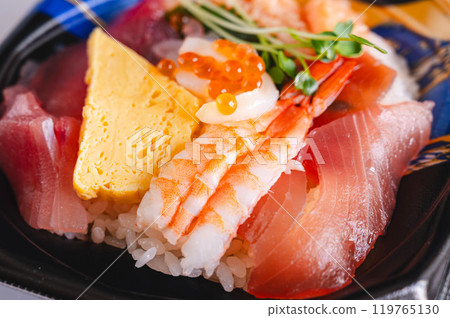 Bowl of rice topped with sashimi Bowl of rice topped with sashimi 119765130