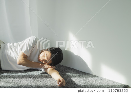 Young man at the window side 119765263
