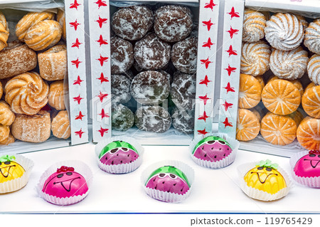 Various pastry on the counter of pastry shop for sale - cookies, gingerbread and various cakes. Various pastry on the counter of pastry shop for sale - cookies, gingerbread and various cakes. 119765429