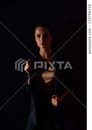 Beautiful fashionable woman in gray business suit 119766358