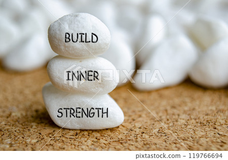 Build Inner Strength text on white stones. Inner strength concept Build Inner Strength text on white stones. Inner strength concept 119766694