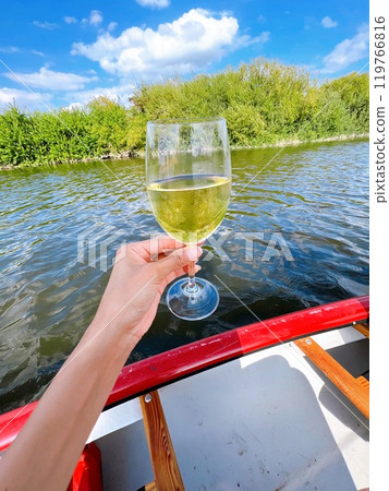 Hand holding white wine Hand holding white wine 119766816