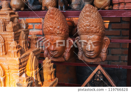 Clay Buddhist masks in souvenir shop in Vietnam in Asia 119766828