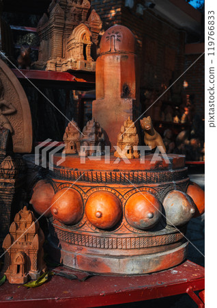 Clay figurines and statues of lingam in souvenir shop in Vietnam in Asia Clay figurines and statues of lingam in souvenir shop in Vietnam in Asia 119766833