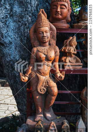 Clay Buddhist figurine statue of female deity in a souvenir shop in Vietnam in Asia 119766835