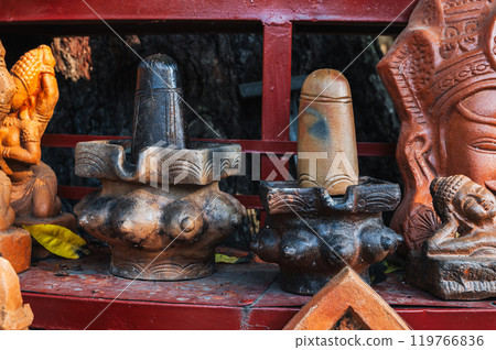 Clay figurines and statues of lingam in souvenir shop in Vietnam in Asia Clay figurines and statues of lingam in souvenir shop in Vietnam in Asia 119766836
