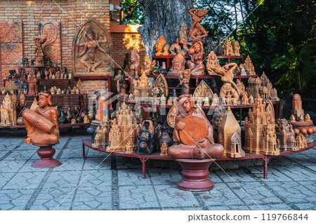 Buddhist religious clay figurines and pottery in souvenir shop on Po Nagar Cham Towers in Nha Trang, Vietnam Buddhist religious clay figurines and pottery in souvenir shop on Po Nagar Cham Towers in Nha Trang, Vietnam 119766844