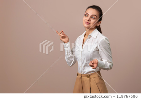 caucasian businesswoman lady in white shirt and beige pants, copy space 119767596