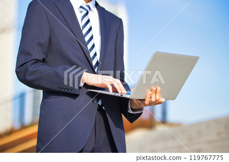 Business image: Young man with a computer Business image: Young man with a computer 119767775