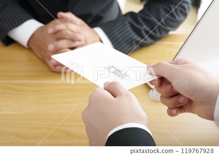 Woman submitting her resignation (no face) Woman submitting her resignation (no face) 119767928