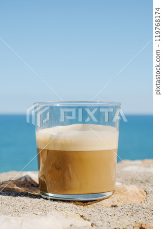 caffe latte or latte macchiato in a glass outdoors caffe latte or latte macchiato in a glass outdoors 119768174