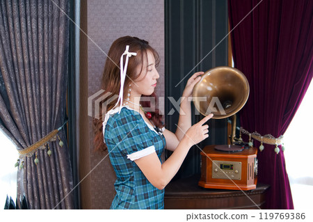 A woman in a blue dress A woman in a blue dress 119769386