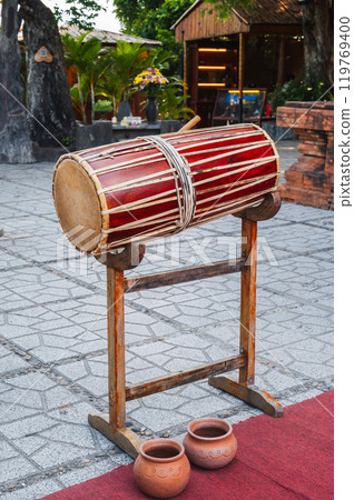 Asian traditional wooden drum for festive music festivals in Vietnam. Vietnamese ancient musical instrument Asian traditional wooden drum for festive music festivals in Vietnam. Vietnamese ancient musical instrument 119769400