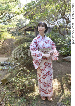 A young woman in a yukata A young woman in a yukata 119770208