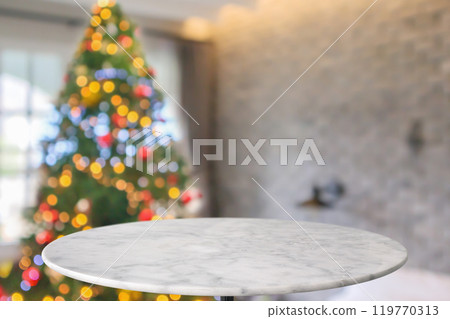 Empty round marble table top with blurred Christmas tree with bokeh light background 119770313
