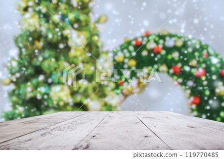 Empty wood table top with blur Christmas tree with bokeh light background Empty wood table top with blur Christmas tree with bokeh light background 119770485