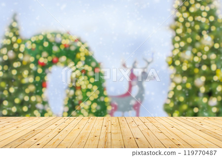 Empty wood table top with blur Christmas tree with bokeh light background 119770487