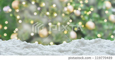 Empty white snow with blur Christmas tree with bokeh light background Empty white snow with blur Christmas tree with bokeh light background 119770489