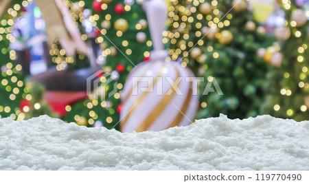 Empty white snow with blur Christmas tree with bokeh light background 119770490