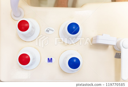 Timer and faucet handles on the bathtub in close-up. Temperature controller for spa treatments. Timer and faucet handles on the bathtub in close-up. Temperature controller for spa treatments. 119770585