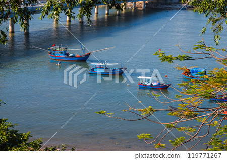 Vietnamese fishing boats on Cai River in Nha Trang in Vietnam Vietnamese fishing boats on Cai River in Nha Trang in Vietnam 119771267