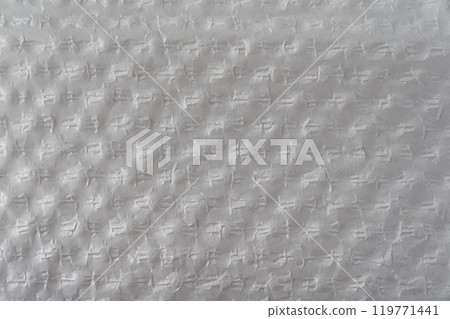 Recycled perforated white paper close up texture 119771441