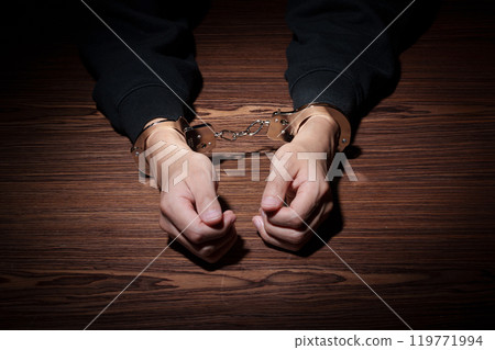 Man in handcuffs 119771994