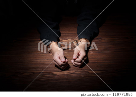 Man in handcuffs 119771995