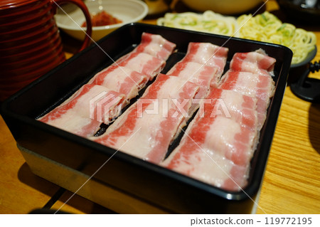 Raw pork belly on black plate for japanese style food. Raw pork belly on black plate for japanese style food. 119772195