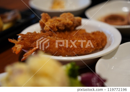 Fried shrimp on the table in a Japanese restaurant Fried shrimp on the table in a Japanese restaurant 119772196