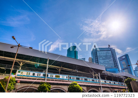 Tokyo cityscape in Japan in October. View of the Hibiya exit of Shinbashi Station and trains. A ray of hope... = 27th Tokyo cityscape in Japan in October. View of the Hibiya exit of Shinbashi Station and trains. A ray of hope... = 27th 119772323