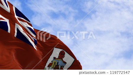 Close-up of the national flag of Bermuda waving in the wind on a clear day. 119772547