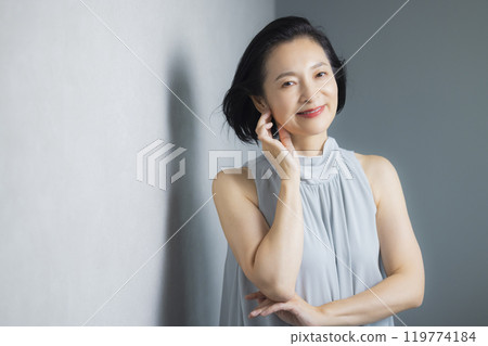 Dressed up middle-aged woman 119774184