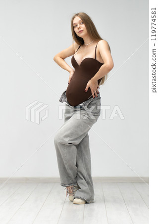 female background expectant mother girl motherhood jeans pregnancy positive maternity tummy happy 119774581