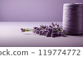 Lavender Flowers and a Spool of Lavender Thread on a Soft Pastel Background Creating a Serene  119774772