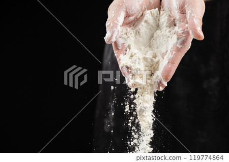 Cook pouring wheat white flour, hands close-up, copy place for text. 119774864