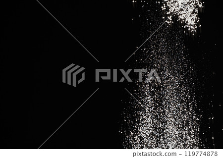 Abstract black and white background of pouring flour, space for text Abstract black and white background of pouring flour, space for text 119774878