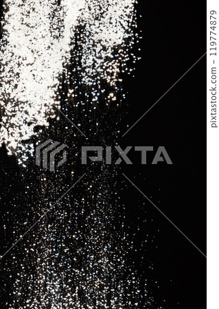 Abstract black and white background of pouring flour, space for text Abstract black and white background of pouring flour, space for text 119774879