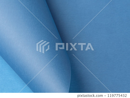 Soft blue paper background with a smooth, pastel texture, creating a simple yet luxurious feel. This 119775432