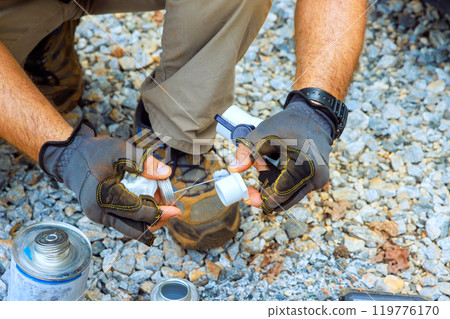 Gluing pvc pipe, plumber applies glue connected to water supply pipe of PVC it is being connected to artesian well system 119776170