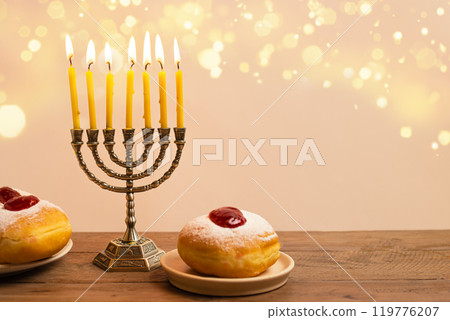 Hanukkah composition with Menorah, candles and sufganiyah jelly donuts 119776207