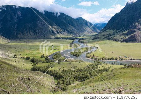 Picturesque green River Valley. Summertime natural landscape mountains in clouds Picturesque green River Valley. Summertime natural landscape mountains in clouds 119776255