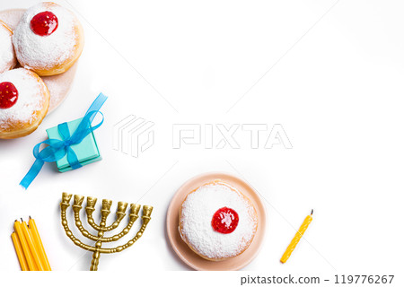 Hanukkah Menorah, candles and sufganiyah jelly donuts Hanukkah Menorah, candles and sufganiyah jelly donuts 119776267