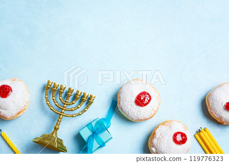 Hanukkah Background with Menorah and sufganiyah jelly donuts Hanukkah Background with Menorah and sufganiyah jelly donuts 119776323